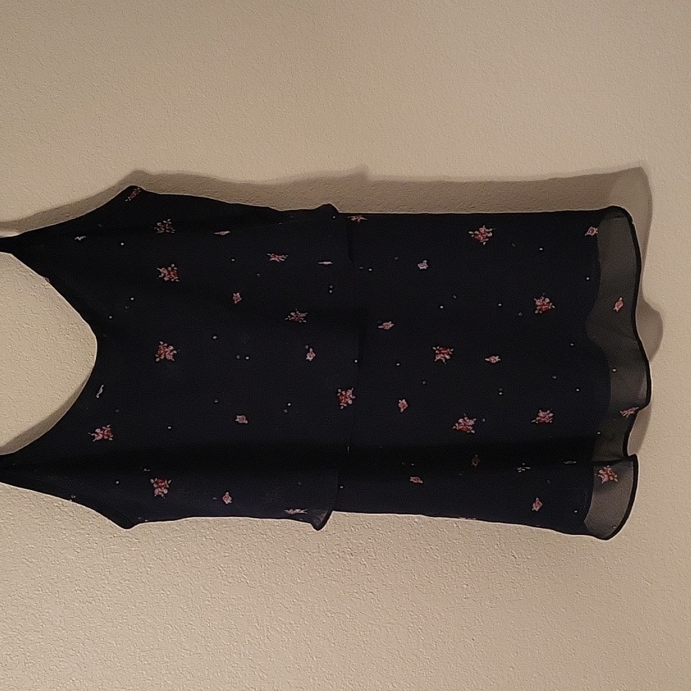 Tank top with flowers on it.